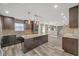Modern kitchen with granite countertops, dark cabinetry, and stainless steel appliances at 81 Sheffield Ln, Powder Springs, GA 30127