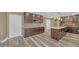 Spacious kitchen with stainless steel appliances, a granite island, wooden floors and dark cabinets at 81 Sheffield Ln, Powder Springs, GA 30127