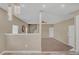 View of the living room with carpet, and stairs to the upper level at 81 Sheffield Ln, Powder Springs, GA 30127