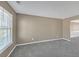 Bright living room with neutral carpet and paint, and large windows for natural light at 81 Sheffield Ln, Powder Springs, GA 30127
