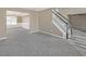 Open-concept space featuring hardwood floors, staircase, and adjacent dining room at 81 Sheffield Ln, Powder Springs, GA 30127