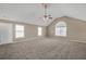 A spacious main bedroom features carpet, a ceiling fan, and three windows for natural light at 81 Sheffield Ln, Powder Springs, GA 30127