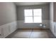 Bright dining room showcases wood flooring, wainscoting, and a large window at 84 Jennifer Ln, Covington, GA 30016