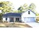 Charming single-Gathering home features neutral paint, attached garage, and inviting front porch at 84 Jennifer Ln, Covington, GA 30016