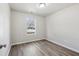 Spare bedroom with wood-look floors and neutral decor at 1246 Bell Ave, East Point, GA 30344