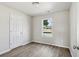 Cozy bedroom with wood-look floors and ample natural light at 1246 Bell Ave, East Point, GA 30344