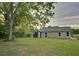 Rear exterior view of the property with a spacious backyard at 1246 Bell Ave, East Point, GA 30344