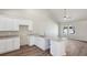 Stylish kitchen features white cabinets, granite counters, and modern appliances at 1246 Bell Ave, East Point, GA 30344