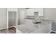 Bright kitchen featuring granite countertops, stainless steel appliances, and ample cabinet space at 1246 Bell Ave, East Point, GA 30344