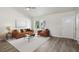 Spacious living room with a ceiling fan and luxury vinyl plank flooring at 1246 Bell Ave, East Point, GA 30344