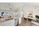 Open living space with a granite kitchen island and a modern dining table at 1246 Bell Ave, East Point, GA 30344