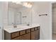 Bathroom with double sink vanity, large mirror, and modern fixtures at 1570 Halbrook Pl, Marietta, GA 30008
