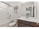 Bathroom featuring a shower-tub combination with modern fixtures and plenty of storage at 1570 Halbrook Pl, Marietta, GA 30008