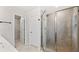 Walk-in shower featuring glass doors, modern fixtures, and ceramic tile at 1570 Halbrook Pl, Marietta, GA 30008