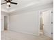 Spacious bedroom featuring a tray ceiling, fan, and access to the ensuite bathroom at 1570 Halbrook Pl, Marietta, GA 30008