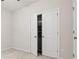 Bright bedroom with carpeted floors featuring a closet with shelving and access to the Primary bathroom at 1570 Halbrook Pl, Marietta, GA 30008