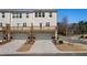 Rear exterior showcasing two-story building, back deck, and garage doors below at 1570 Halbrook Pl, Marietta, GA 30008