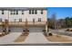 Townhome exterior featuring two-car garage and a rear deck with wood railings at 1570 Halbrook Pl, Marietta, GA 30008