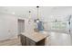 The bright, open kitchen flows into the living area, featuring granite countertops and an island for dining and cooking at 1570 Halbrook Pl, Marietta, GA 30008