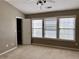 Bedroom with a closet, a ceiling fan, and three windows, letting in natural light at 51 Highoak Ne Dr # 12, Marietta, GA 30066