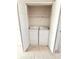 Laundry closet with a washer and dryer and wire shelving at 51 Highoak Ne Dr # 12, Marietta, GA 30066