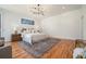 Spacious bedroom with hardwood flooring, neutral walls, and modern lighting fixture at 1099 Hawthorne Ne St, Atlanta, GA 30307