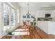 Dining Room featuring natural light, access to the garden, and an adjacent kitchen at 1518 Robins Walk, Alpharetta, GA 30005