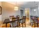 Dining area with modern table and chairs, adjacent to kitchen and living spaces at 825 Highland Ln # 1105, Atlanta, GA 30306