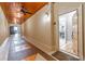 Hallway with tiled floors leading to the unit entrance with an open door to dining area at 825 Highland Ln # 1105, Atlanta, GA 30306