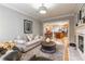 Inviting living room with fireplace that connects to a kitchen with hardwood flooring throughout at 825 Highland Ln # 1105, Atlanta, GA 30306
