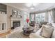 Cozy living room features a fireplace with large windows that provide lots of natural light at 825 Highland Ln # 1105, Atlanta, GA 30306