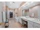 Bright bathroom featuring double sinks, a soaking tub, and a large walk-in closet at 2330 Ventana Xing # 10, Marietta, GA 30062