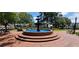 Picturesque tiered fountain surrounded by a brick plaza, benches, and lush green trees at 2330 Ventana Xing # 10, Marietta, GA 30062