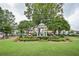 Picturesque gazebo with a green roof and colorful flowerbeds amidst a manicured lawn in a park setting at 2330 Ventana Xing # 10, Marietta, GA 30062