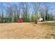 Large backyard featuring expansive lawn with trees and shed at 3406 Woodview Se Dr, Smyrna, GA 30082