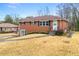 Classic brick home with tidy landscaping, a concrete walkway, and ample natural light at 3406 Woodview Se Dr, Smyrna, GA 30082