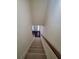 Carpeted staircase with wooden handrail leading to the front door at 4215 Wildener Way, Cumming, GA 30041