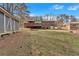 Large, grassy backyard featuring both a shed and a home's covered deck at 4480 Highway 5, Douglasville, GA 30135