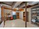 Unfinished basement featuring tile flooring, exposed ductwork, and built-in shelving at 4480 Highway 5, Douglasville, GA 30135