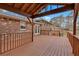 Expansive deck with covered area connected to the home with white double doors at 4480 Highway 5, Douglasville, GA 30135