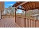 Large deck with a covered seating area and views of the backyard at 4480 Highway 5, Douglasville, GA 30135