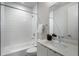 Neat bathroom featuring a tiled shower, vanity with sink, and classic fixtures at 105 City View Ne Ct, Atlanta, GA 30308