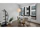 Dining area featuring a modern table and chairs, large window with neighborhood view at 105 City View Ne Ct, Atlanta, GA 30308