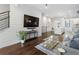 Bright living room with hardwood floors, modern decor, and shiplap accent wall at 105 City View Ne Ct, Atlanta, GA 30308