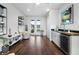 Stylish living area with dark wood floors, wine cooler, and lots of plants at 105 City View Ne Ct, Atlanta, GA 30308