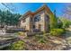 Two-story brick home with a terraced backyard and outdoor seating area at 1181 Fairview Ne Rd, Atlanta, GA 30306