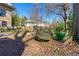 Backyard features tire swing and patio furniture with views of brick home at 1181 Fairview Ne Rd, Atlanta, GA 30306