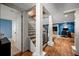 Basement features a staircase and living area with geometric accent wall and adjacent desk at 1181 Fairview Ne Rd, Atlanta, GA 30306