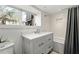 Bathroom features a vanity with carrara marble countertop and shower with subway tile at 1181 Fairview Ne Rd, Atlanta, GA 30306