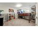 Bedroom with neutral carpet features a loft bed and adjacent storage with decor and books at 1181 Fairview Ne Rd, Atlanta, GA 30306